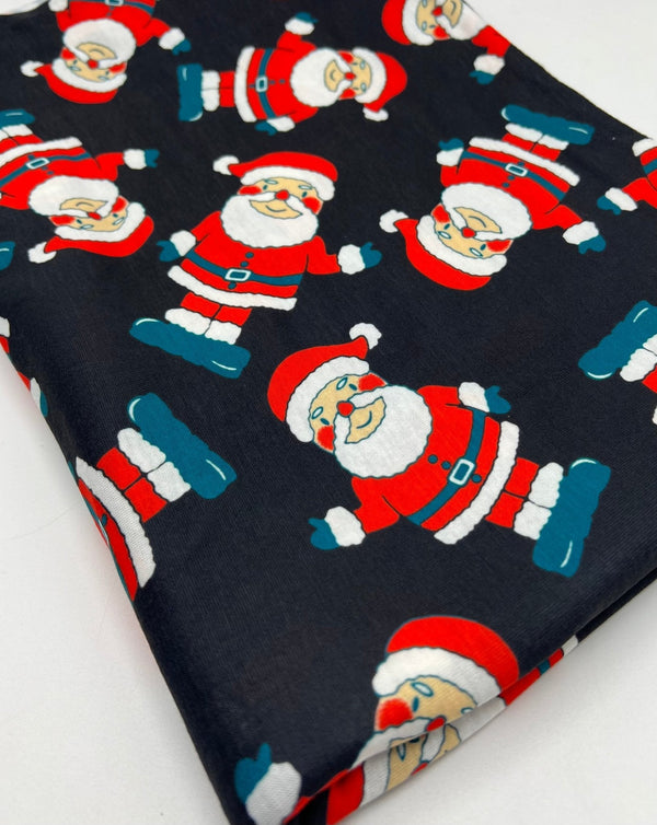 Black Rosy Cheek Santa Print Soft Spun Poly Stretch Fabric