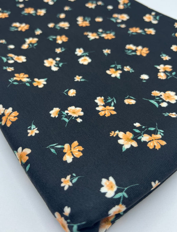 Black Orange Ditsy Floral Print Soft Spun Poly Stretch Fabric