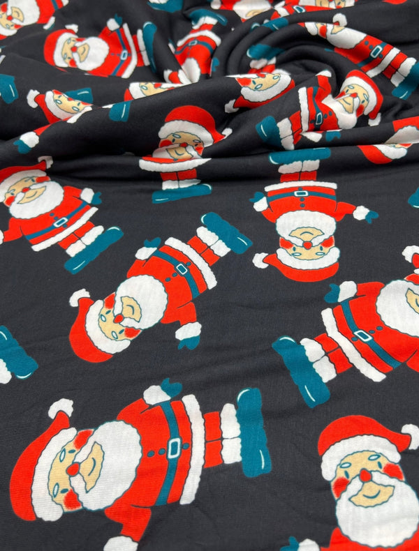 Black Rosy Cheek Santa Print Soft Spun Poly Stretch Fabric