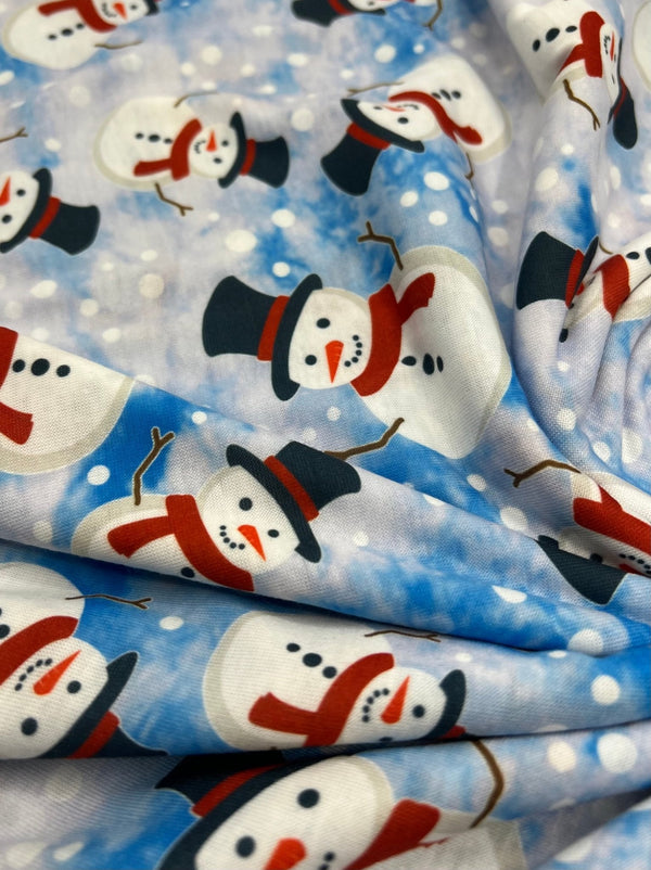 Blue Snow Snowman Print Soft Spun Poly Stretch Fabric