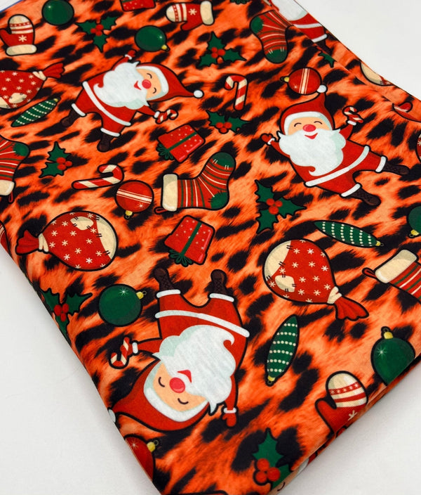 Orange Animal Santa Print Soft Spun Poly Stretch Fabric