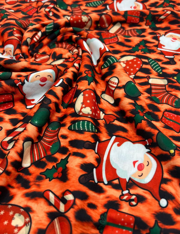 Orange Animal Santa Print Soft Spun Poly Stretch Fabric