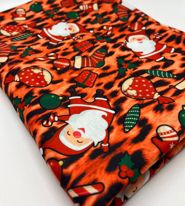 Orange Animal Santa Print Soft Spun Poly Stretch Fabric