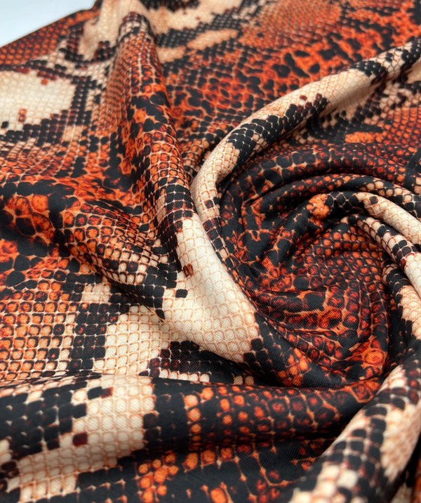 Rust Snake Print Spun Poly Stretch Fabric