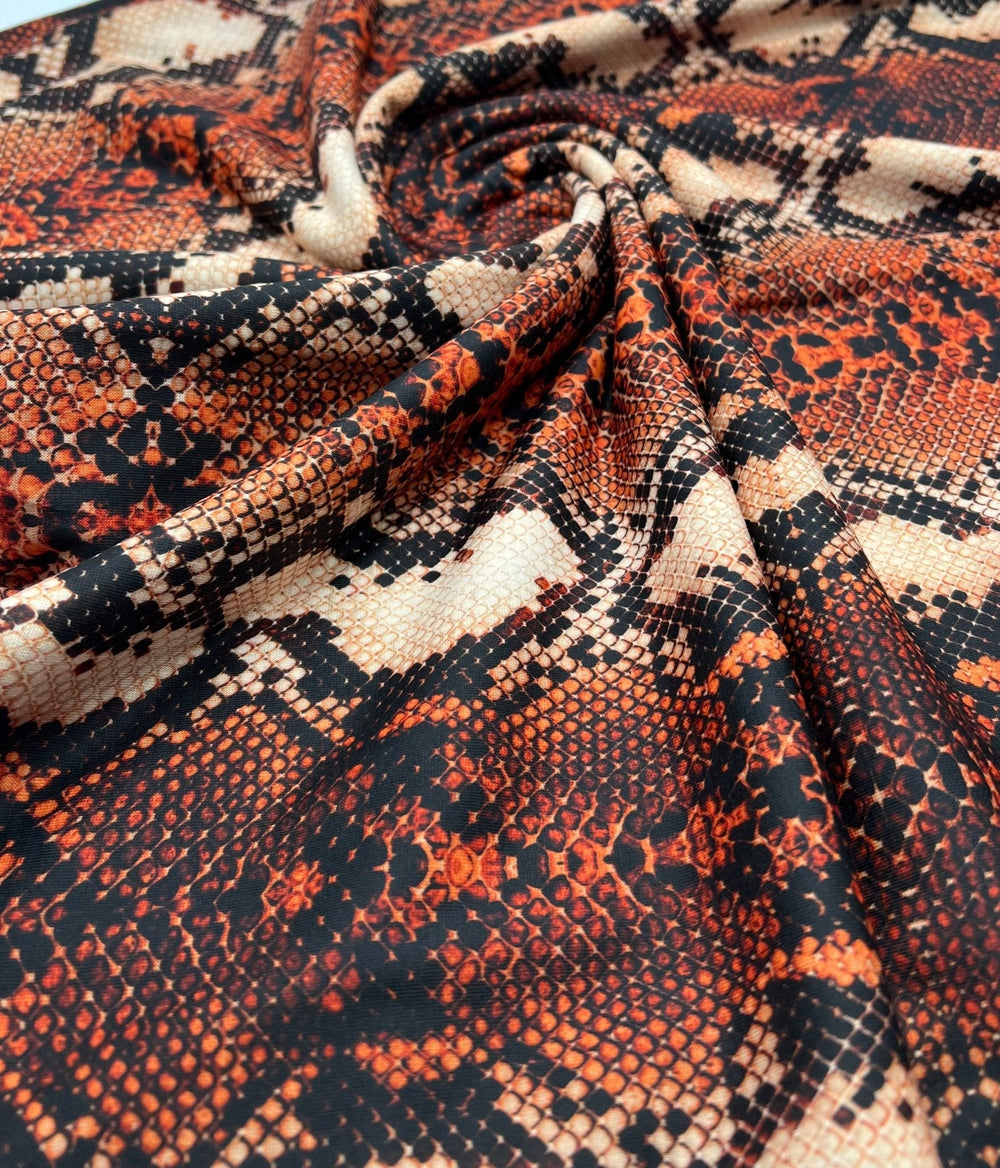 Rust Snake Print Spun Poly Stretch Fabric