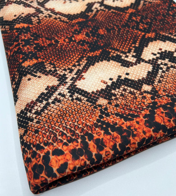 Rust Snake Print Spun Poly Stretch Fabric
