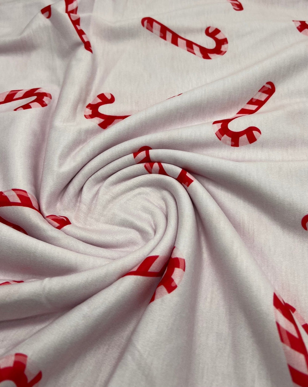 Soft Pink Candy Cane Print Soft Spun Poly Stretch Fabric